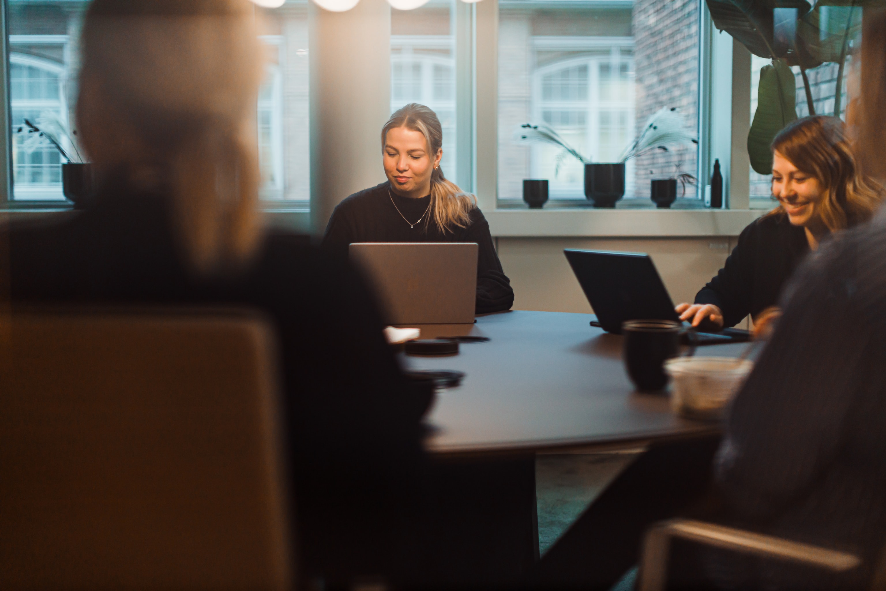 People sitting at a table in a meeting